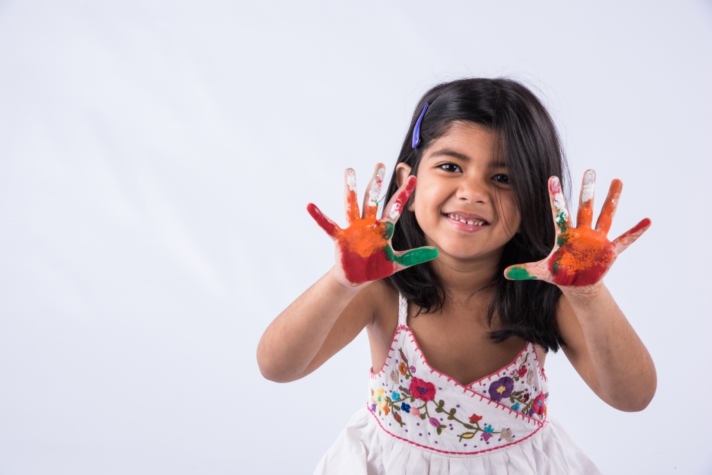 StockImageFactory.com-photo-ID(0000143113)indian-cute-girl-with-colourful-palm-over-white-background