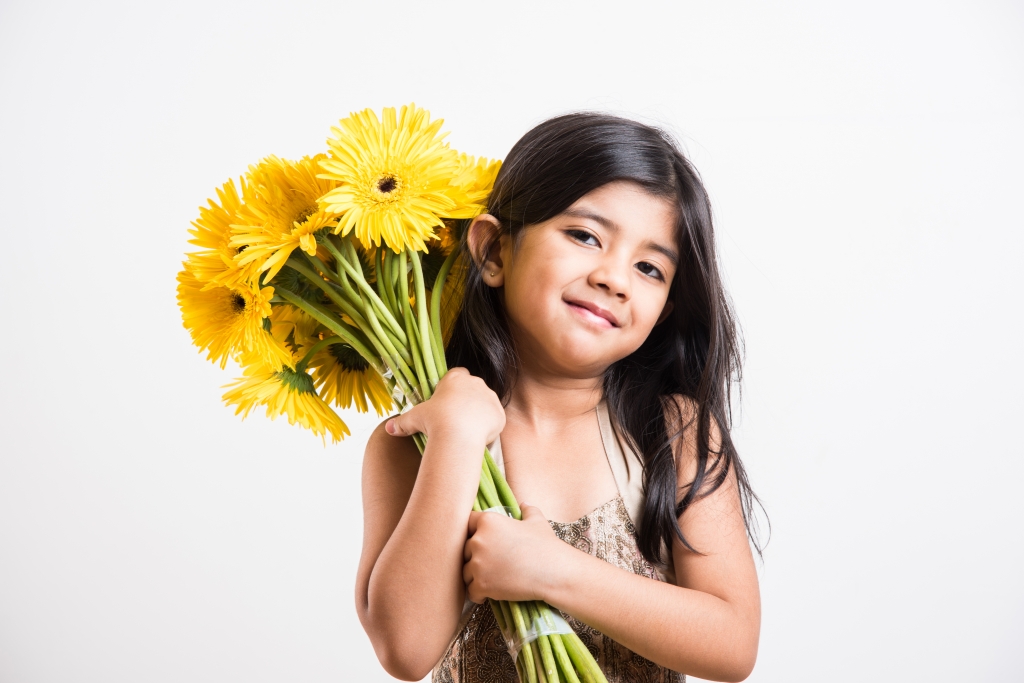 StockImageFactory.com-photo-ID(0000144940)small-girl-holding-flower-bouquet-bunch-of-flowers